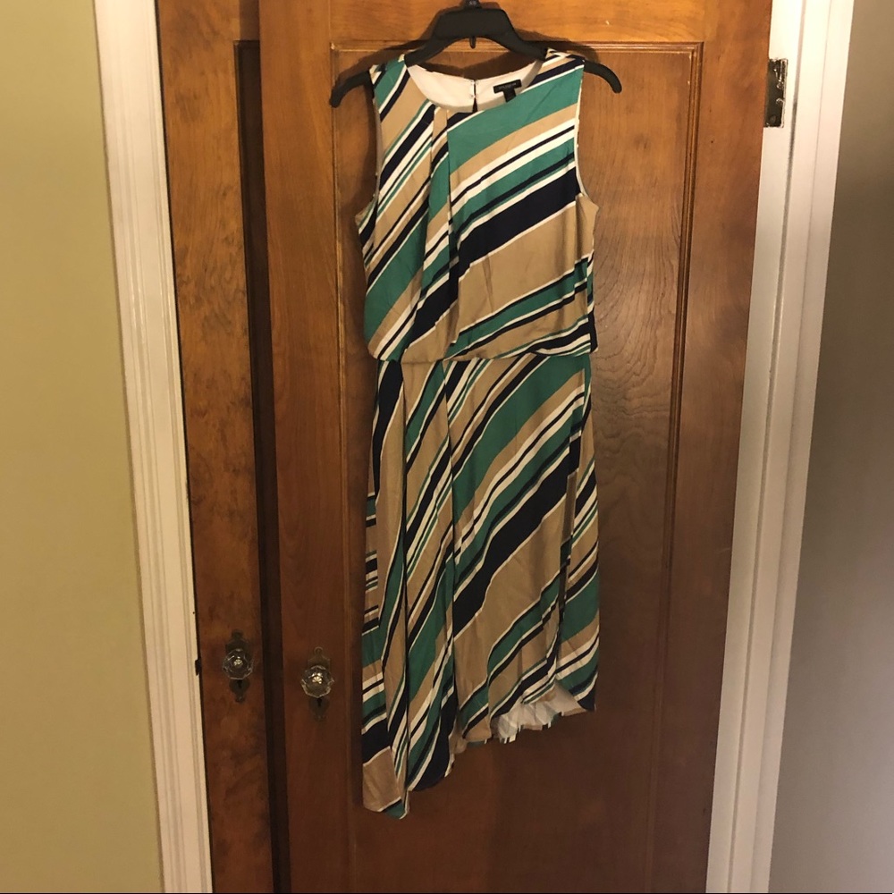 Sleeveless asymmetrical dress.